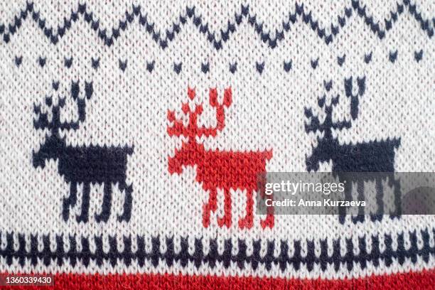 full frame of christmas red knitted sweater. christmas gift. - パタンナー ストックフォトと画像