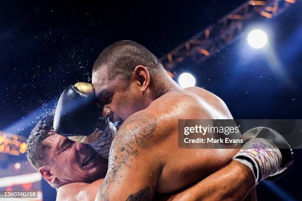 Joey Leilua and Chris Heighington fight during their Footy Fight Night Christmas Bash heavyweight bout at The Star on December 22, 2021 in Sydney,...