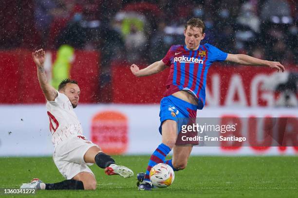 Ivan Rakitic of Sevilla FC competes for the ball with Frenkie De Jong of FC Barcelona during the LaLiga Santander match between Sevilla FC and FC...