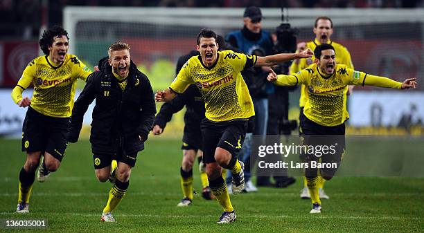 Sebastian Kehl of Dortmund and his team mates Mats Hummels, Jakub Blaszczykowski and Ilkay Guendogan celebrate after winning the DFB Cup third round...