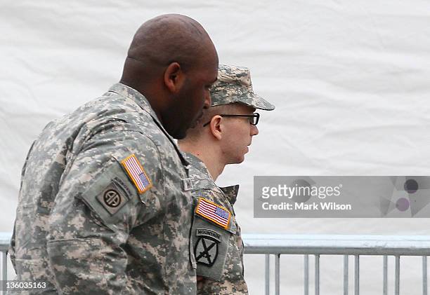 Pfc. Bradley Manning is escorted into a building to attend the second day of his Article 32 hearing, on December 17, 2011 in Fort Meade, Maryland....