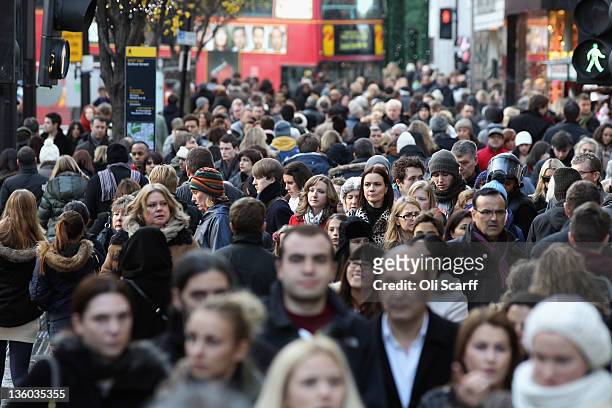 Consumers peruse the shops on Oxford Street on the penultimate Saturday before Christmas Day on December 17, 2011 in London, England. Retail analysts...