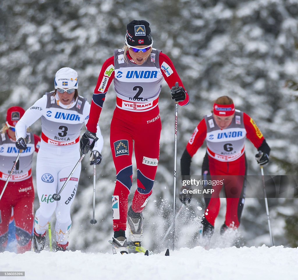 Therese Johaug of Norway leads the pack