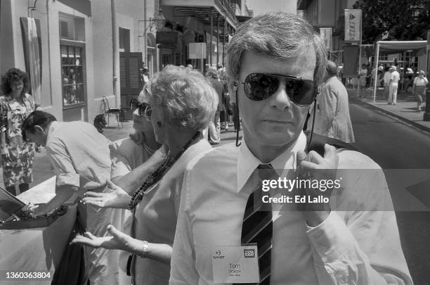 Portrait of American broadcast journalist Tom Brokaw attends a party at Brennan's Restaurant, New Orleans, Louisiana, between August 15 - 18, 1988....