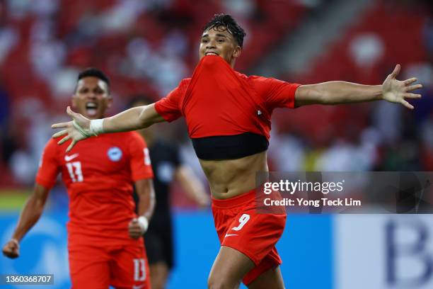 Ikhsan Fandi of Singapore celebrates after scoring his team's first goal against Indonesia in the second half during the first leg of their AFF...