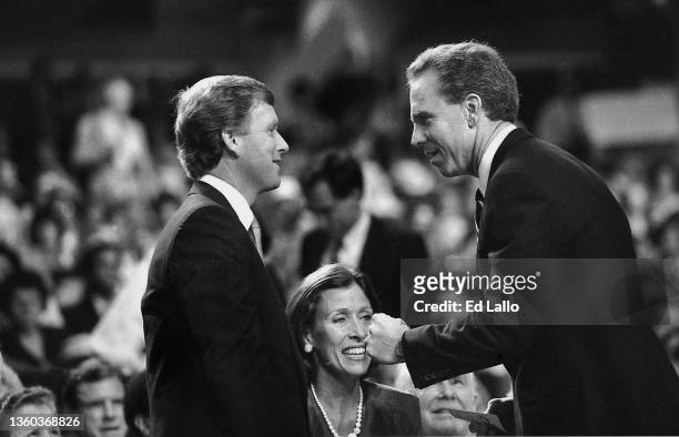 American politician Dan Quayle speaks with an unidentified man during the 1988 Republican National Convention, New Orleans, Louisiana, between August...