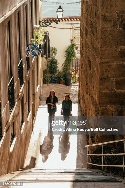 2 women exploring Lisbon city on a sunny day