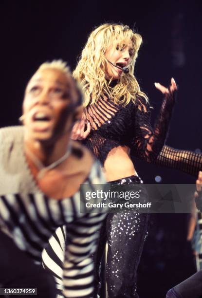 With an unidentified dancer , American Pop singer Britney Spears performs onstage, during her 'Dream Within a Dream' tour, at Continental Airlines...