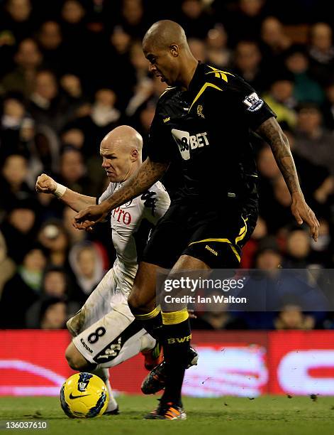 Andrew Johnson of Fulham and Zat Knight of Bolton battle for the ball during the Barclays Premier League match between Fulham and Bolton Wanderers at...