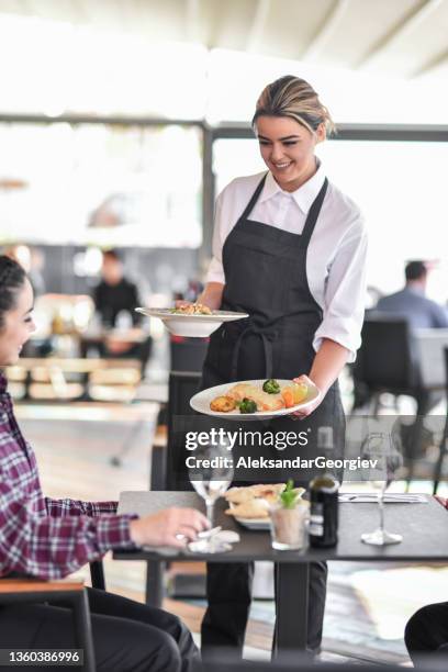 couple receiving fancy appetizer before main course in restaurant from waitress - course meal stock pictures, royalty-free photos & images