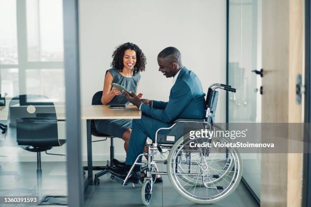 business partners in meeting. - wheelchair stock pictures, royalty-free photos & images