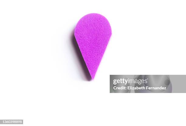 purple make-up sponge on white background - drop pin imagens e fotografias de stock