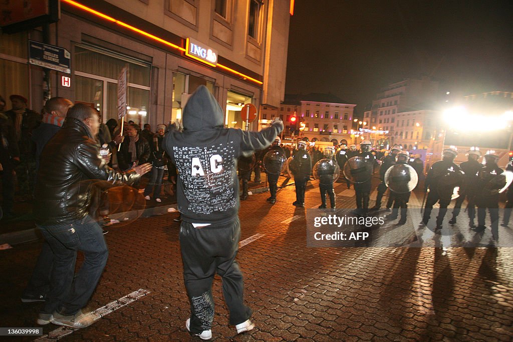 Protesters face police during a demonstr