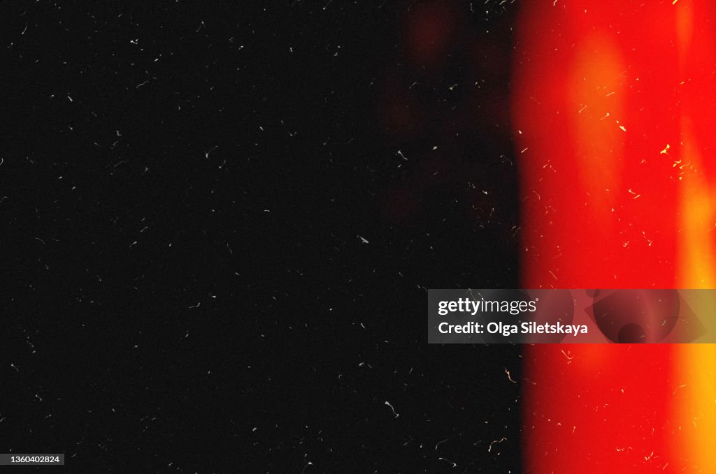 Film glare, noise and scratches on a black background