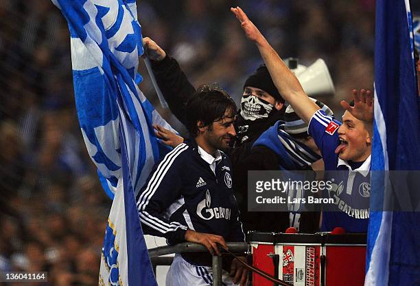 Raul Gonzalez and Kyriakos Papadopoulos of Schalke celebrate with the fans after winning the Bundesliga match between FC Schalke 04 and SV Werder...