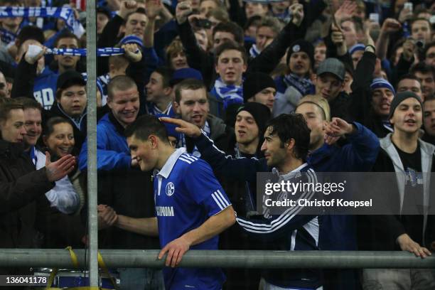 Kyriakos Papadopoulos and Raul Gonzalez of Schalke celebrate wit the fans after the Bundesliga match between FC Schalke 04 and SV Werder Bremen at...