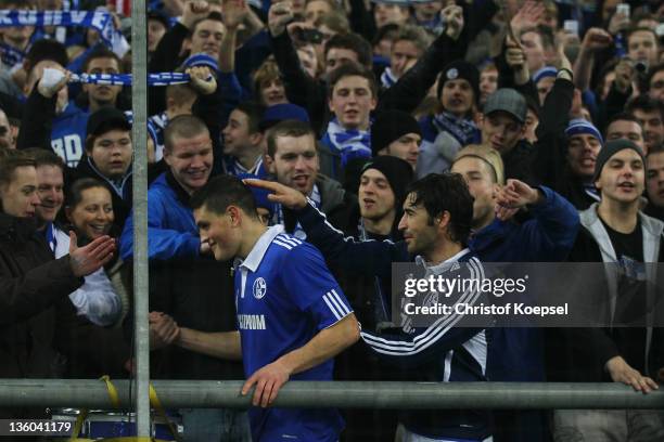 Kyriakos Papadopoulos and Raul Gonzalez of Schalke celebrate wit the fans after the Bundesliga match between FC Schalke 04 and SV Werder Bremen at...