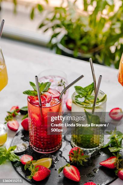 close-up of drinks on table - mojito stock pictures, royalty-free photos & images