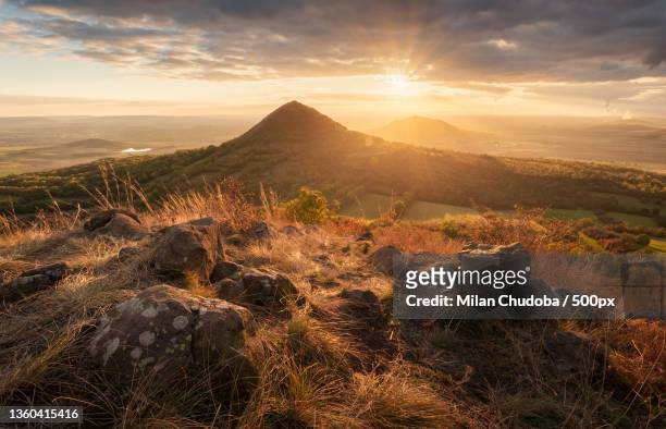 golden central mountains,scenic view of landscape against sky during sunset,czech republic - czech republic stock-fotos und bilder