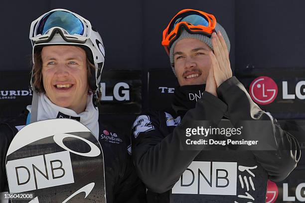 Stian Sivertzen and Joachim Havikhagen of Norway take the podium in third place in the men's team snowboardcross at the LG Snowboard FIS World Cupon...