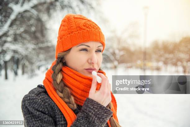 winter mood without chapped lips - winter skin stock pictures, royalty-free photos & images