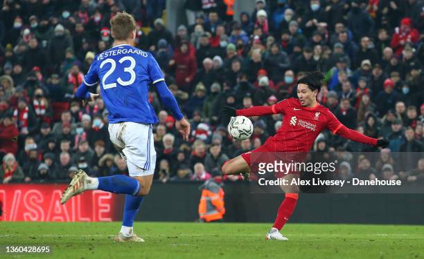 Takumi Minamino of Liverpool scores their third goal during the Carabao Cup Quarter Final match between Liverpool and Leicester City at Anfield on...