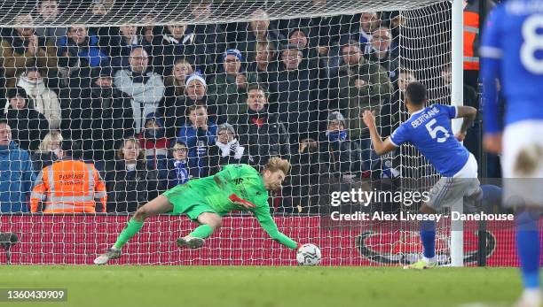 Caoimhin Kelleher of Liverpool saves a penalty from Ryan Bertrandof Leicester City during the Carabao Cup Quarter Final match between Liverpool and...