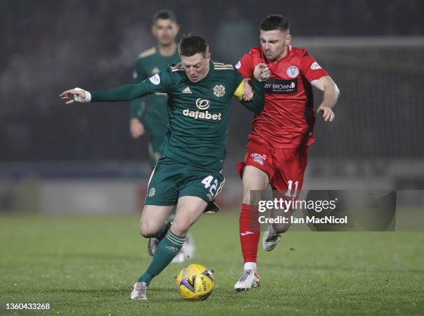 Calum McGregor of Celtic vie with Greg Kiltie of St Mirren during the Cinch Scottish Premiership match between St. Mirren FC and Celtic FC at on...