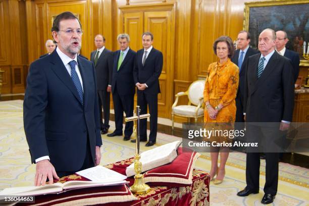 New Spanish Prime Minister Mariano Rajoy is sworn in in front of King Juan Carlos of Spain and Queen Sofia of Spain during a ceremony at the Zarzuela...