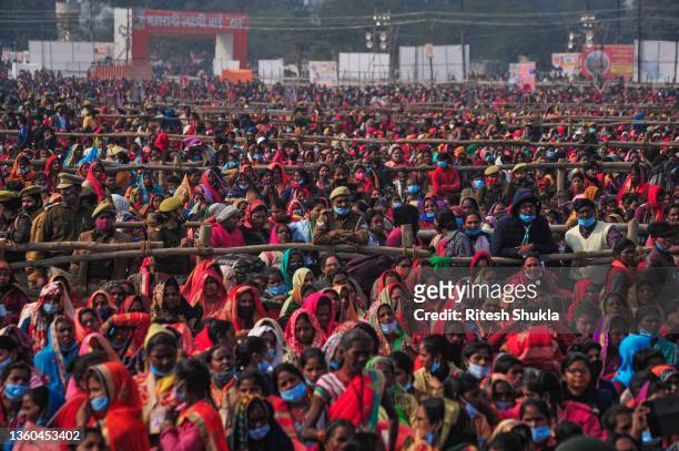 Women from various districts arrive to attend a rally held by India's Prime Minister Narendra Modi on December 21, 2021 in Allahabad, India. Modi...