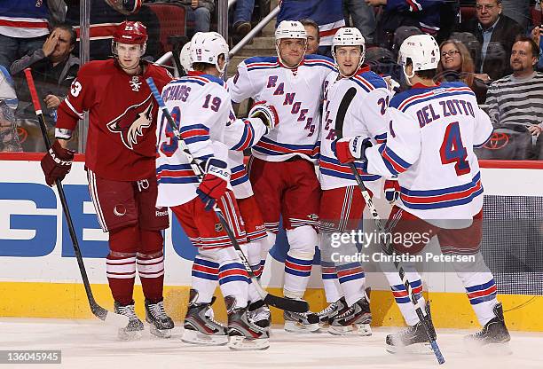 Marian Gaborik of the New York Rangers celebrates with Brad Richards, Derek Stepan and Michael Del Zotto after Gaborik scored a first-period...