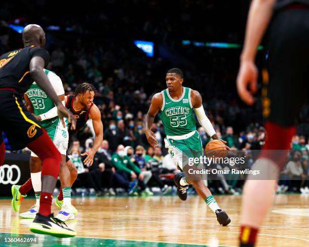 Joe Johnson of the Boston Celtics brings the ball up court during the fourth quarter of the game against the Cleveland Cavaliers at TD Garden on...