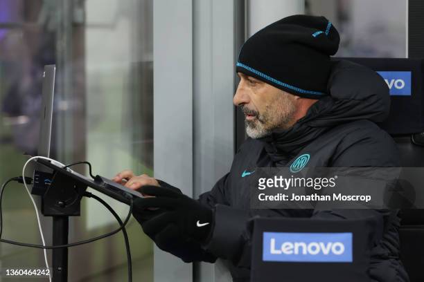 Marco Cecchi FC Internazionale Technical Assistant sets up a computer on the bench prior to kick off in the Serie A match between FC Internazionale...