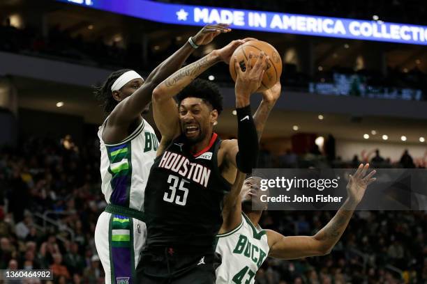 Christian Wood of the Houston Rockets grabs a rebound during the second half of the game against the Milwaukee Bucks at Fiserv Forum on December 22,...