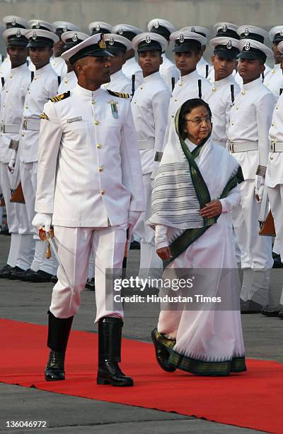 President Pratibha Patil inspects a guard of honor during Fleet Review 2011on December 20, 2011 in Mumbai, India. A total of 81 ships, including over...