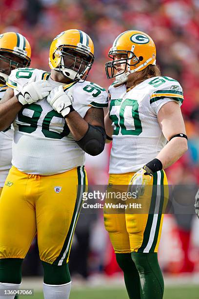 Raji and A.J. Hawk of the Green Bay Packers talk before a play against the Kansas City Chiefs at Arrowhead Stadium on December 18, 2011 in Kansas...