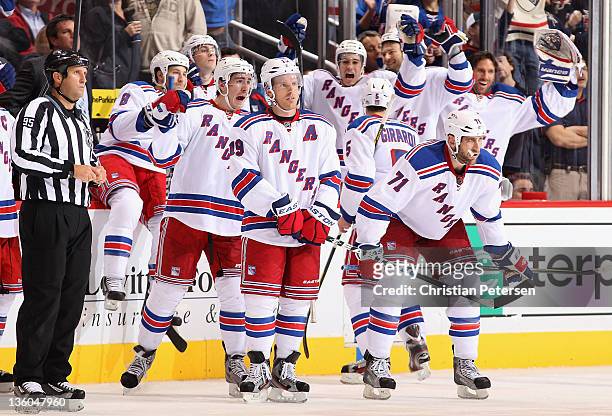 Ryan McDonagh, Brad Richards and Mike Rupp of the New York Rangers celebrate after Richards scored on a reviewed goal in the final second of the NHL...
