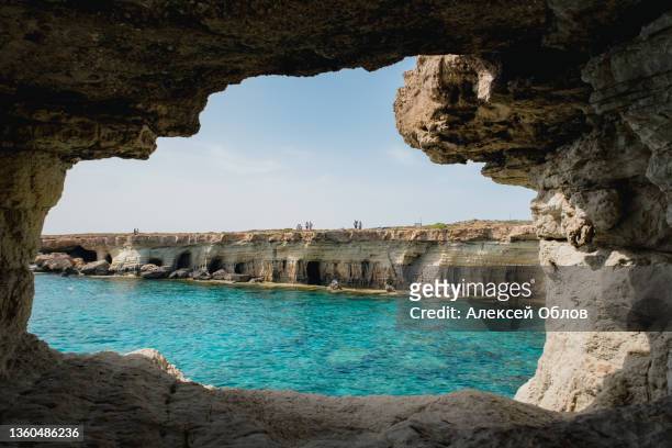 natural landmark of cyprus. sea caves in cape greko national park near ayia napa and protaras - zypern stock-fotos und bilder