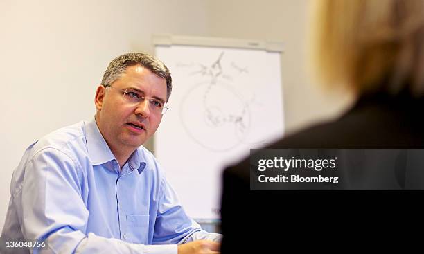 Severin Schwan, chief executive officer of Roche Holding AG, left, speaks during an interview at the company's headquarters in Basel, Switzerland, on...