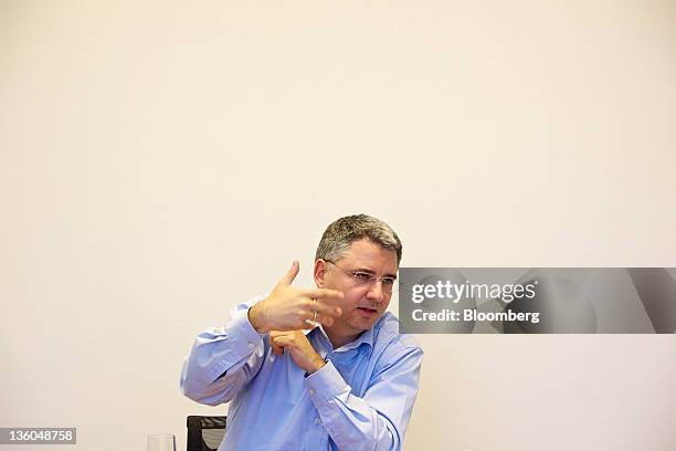 Severin Schwan, chief executive officer of Roche Holding AG, gestures during an interview at the company's headquarters in Basel, Switzerland, on...