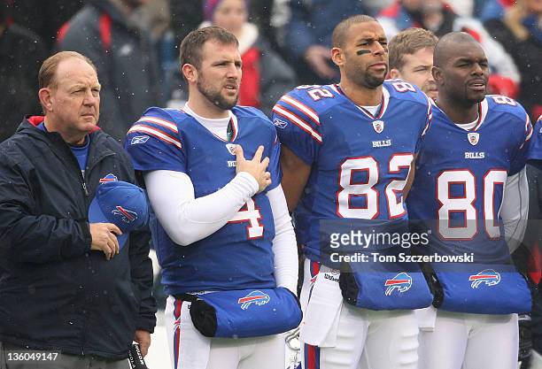 Head coach Chan Gailey Tyler Thigpen Ruvell Martin Ryan Fitzpatrick and Derek Hagan of the Buffalo Bills stand for the playing of the anthem before...