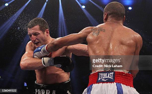 Andre Ward lands a left on Carl Froch of England during their WBA/WBC Super Middleweight Championship bout at Boardwalk Hall on December 17, 2011 in...