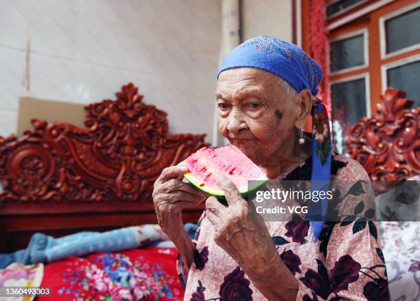 Alimihan Seyiti eats watermelon on August 22, 2021 in Kashgar, Xinjiang Uygur Autonomous Region of China. Alimihan Seyiti, the oldest person in...