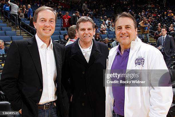 Golden State Warriors owner Joe Lacob and Sacramento Kings owners Joe Maloof and Gavin Maloof pose for the camera before a preseason game on December...
