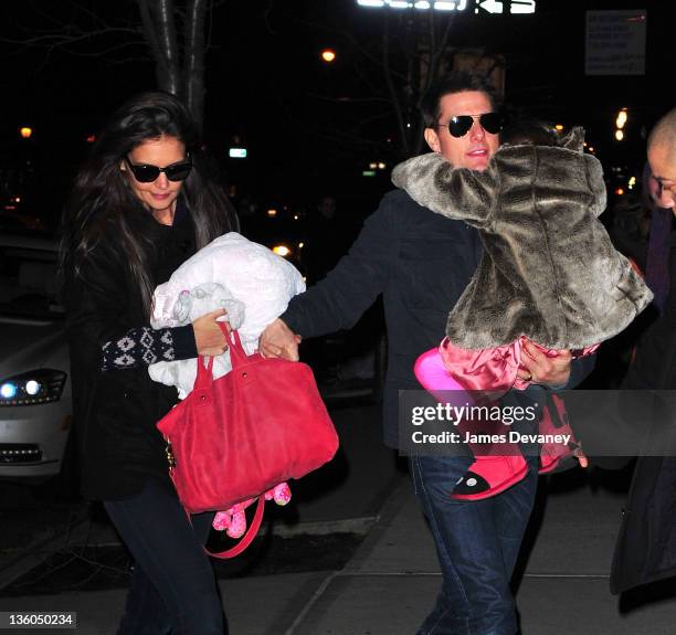 Katie Holmes, Tom Cruise and Suri Cruise seen on the streets of Manhattan on December 17, 2011 in New York City.