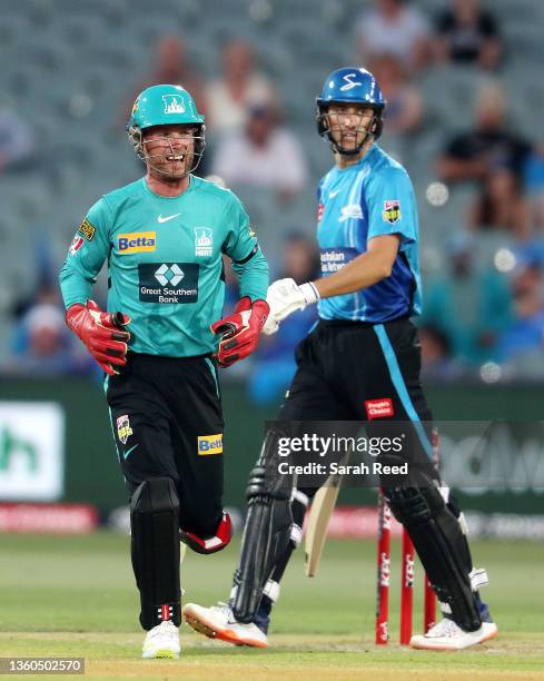 Jimmy Peirson of the Heat all smiles after taking the catch to dismiss Matt Short of the Strikers for 14 runs off the bowling of Matt Kuhnemann of...