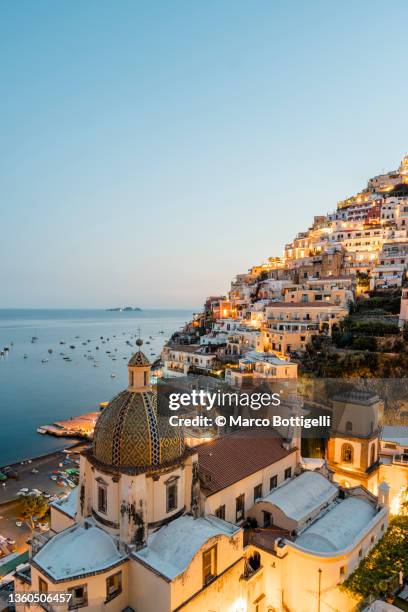 positano at dusk, italy - amalfi coast stock-fotos und bilder