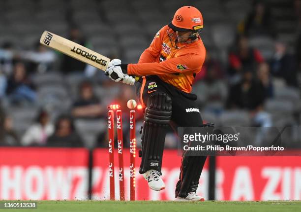 Colin Munro of Perth Scorchers is bowled by Kane Richardson during the Men's Big Bash League match between the Melbourne Renegades and the Perth...