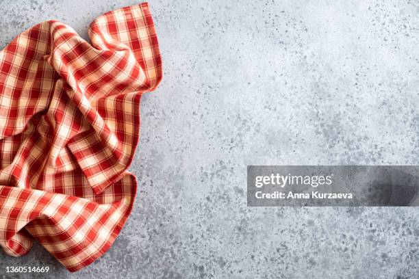 red linen checkered napkin folded on grey concrete background, top view. copy space - dish towel stock pictures, royalty-free photos & images