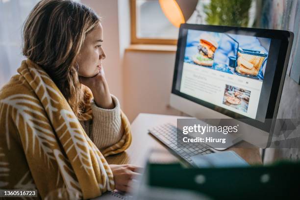 woman reading recipes - browsing the internet stock pictures, royalty-free photos & images